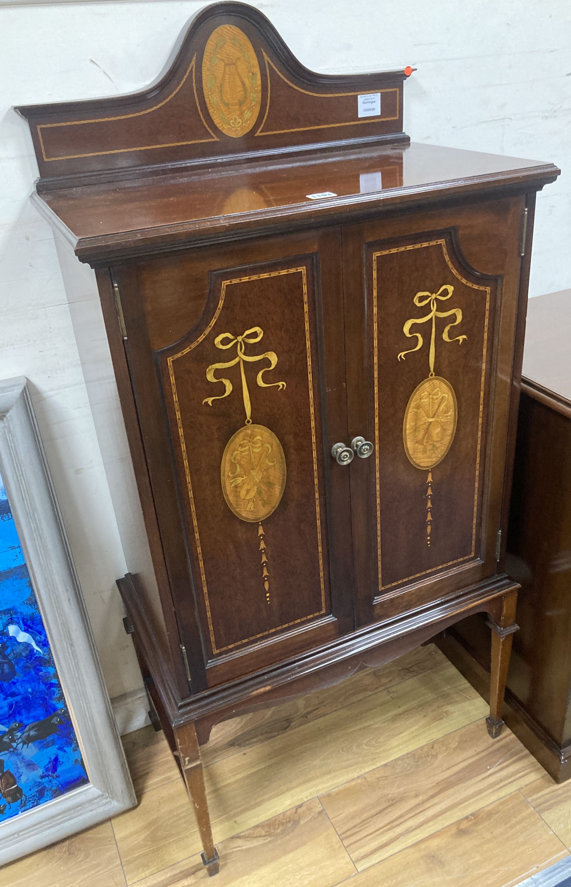 A Sheraton revival mahogany and marquetry music cabinet (later stand?), width 64cm, depth 37cm, height 130cm